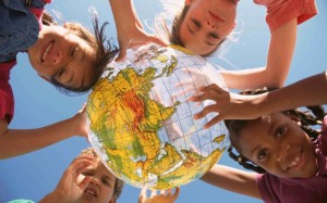 kids holding a globe